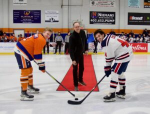 Wout Rehorst (left) Ralph Hummel (middle) and Hunter Cobb (right) pose for the ceremonial puck drop. (Naomi Gardner/High River Flyers)