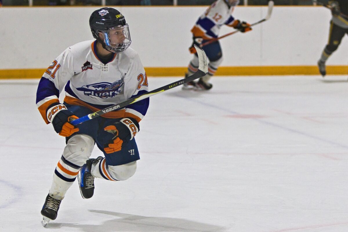 Lucas Gough skating up the ice against the Agra Risk Wheatland Kings. (Scott Savard/High River Flyers)