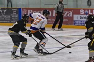 Gage Hallam moving the puck against the Kings earlier in the season. (Scott Savard/High River Flyers)