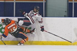 Kieren McNaughton colliding with a Bison. (Scott Savard/High River Flyers)