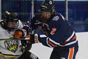Wout Rehorst with a clean hit against the Kings. (Scott Savard/High River Flyers)