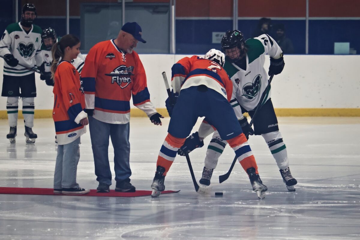 Charlie Brown dropping the ceremonial puck drop during a High River Flyers game against the Rocky Rams. (Scott Savard/High River Flyers)