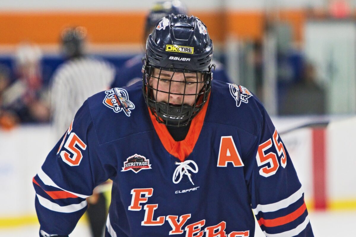 Lucas Hughes lining up for a draw while donning the Flyers new crisp blue uniforms. (Scott Savard/High River Flyers)