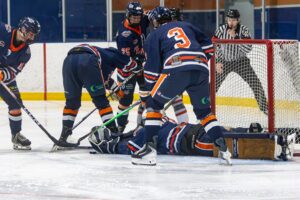 The Flyers protecting Erich Baxter and the blue paint. (Scott Savard/High River Flyers)